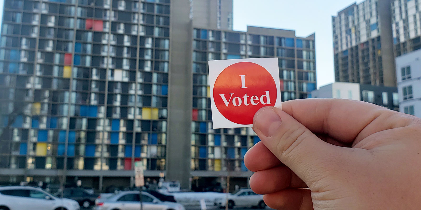 Hand holding I voted sticker