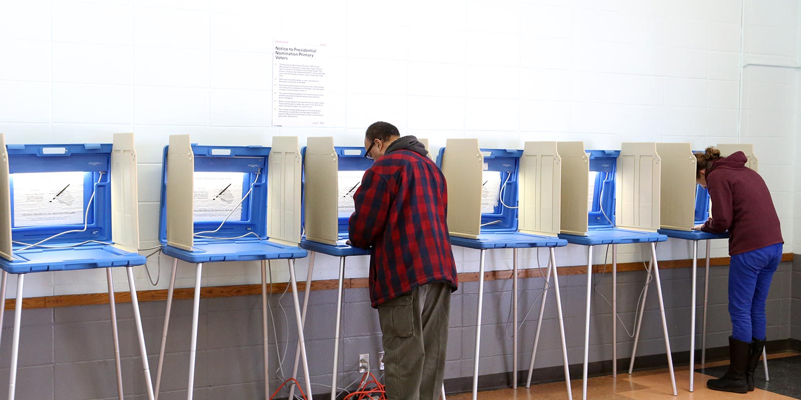 Voters complete their ballots in polling place