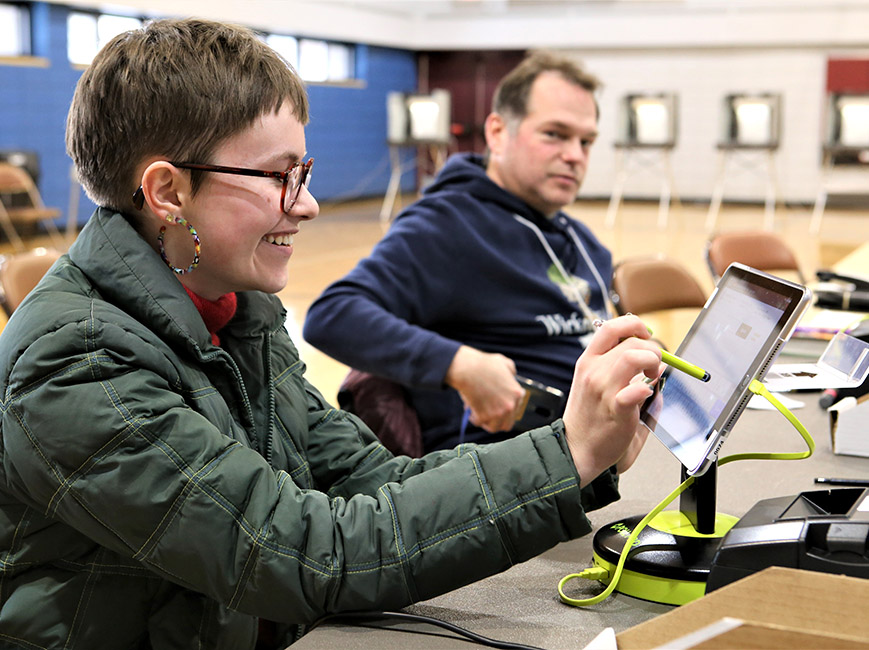 student election judge working with a poll pad